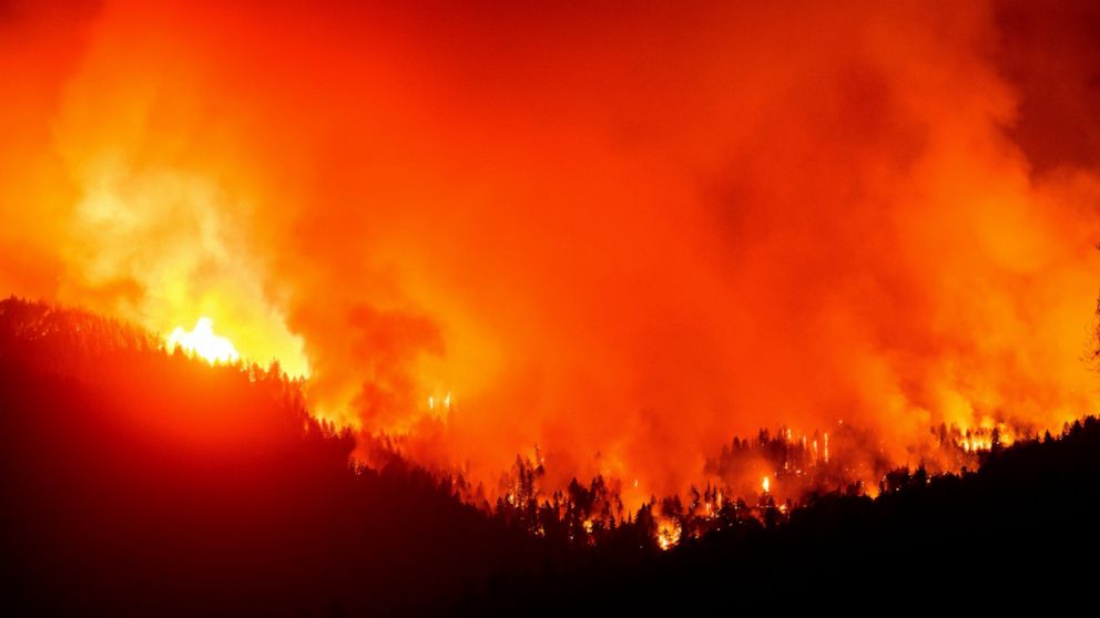 The August Complex Fire burns near Lake Pillsbury in the Mendocino National Forest, Calif., on Wednesday, Sept. 16, 2020. (AP Photo/Noah Berger)