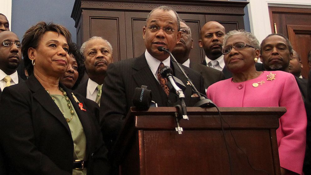 FILE - Rep. Barbara Lee, D-Calif., Rev. Calvin Butts, and Rep. Alcee Hastings, D-Fla., are joined at podium by other church and community leaders from New York, on Capitol Hill in Washington, Wednesday, March 17, 2010. Butts, who welcomed generations