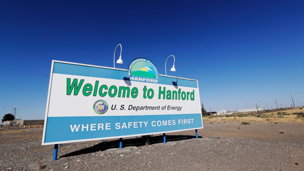 FILE - In this Aug. 13, 2019, file photo, a sign at the Hanford Nuclear Reservation is posted near Richland, Wash. Officials say an underground nuclear waste storage tank that dates to World War II appears to be leaking contaminated liquid into the g
