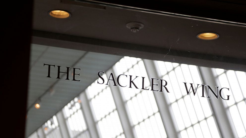 FILE - In this Jan. 17, 2019, file photo, a sign with the Sackler name is displayed at the Metropolitan Museum of Art in New York. Their name used to be on a wing at the Louvre. But now the Sackler family wealth has become linked to sales of OxyConti