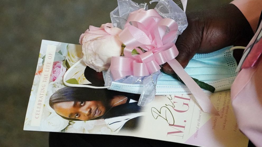 FILE - Marvin Grier holds a program during a funeral service for his daughter Brianna Grier on Aug. 11, 2022, in Atlanta. Prosecutors will not seek an indictment against sheriff's deputies in the death of Grier, a handcuffed Georgia woman who fell fr