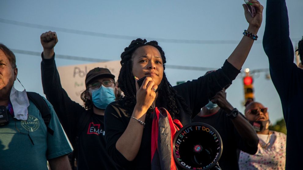 Mallory Thornton, of Durham, leads chants on a bullhorn while demonstrators marched peacefully in Elizabeth City, N.C., on Monday April 26, 2021, after family viewed 20 seconds of police body camera video of the shooting death of Andrew Brown Jr. Bro