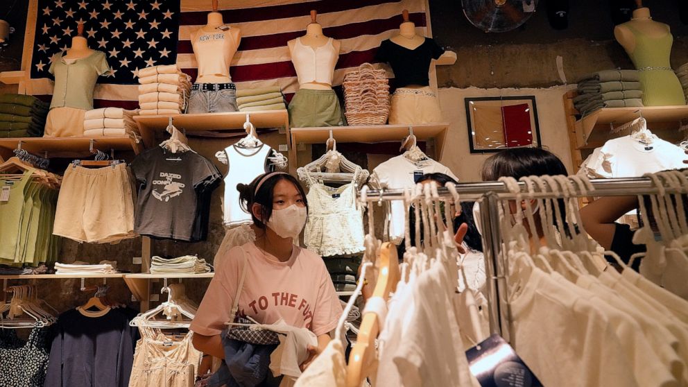 Women wearing face masks shop at an American fashion boutique in Beijing on Sunday, July 11, 2021. China on Tuesday, July 13, denounced an appeal by Treasury Secretary Janet Yellen for a U.S.-European "unified front" against Chinese "unfair economic 
