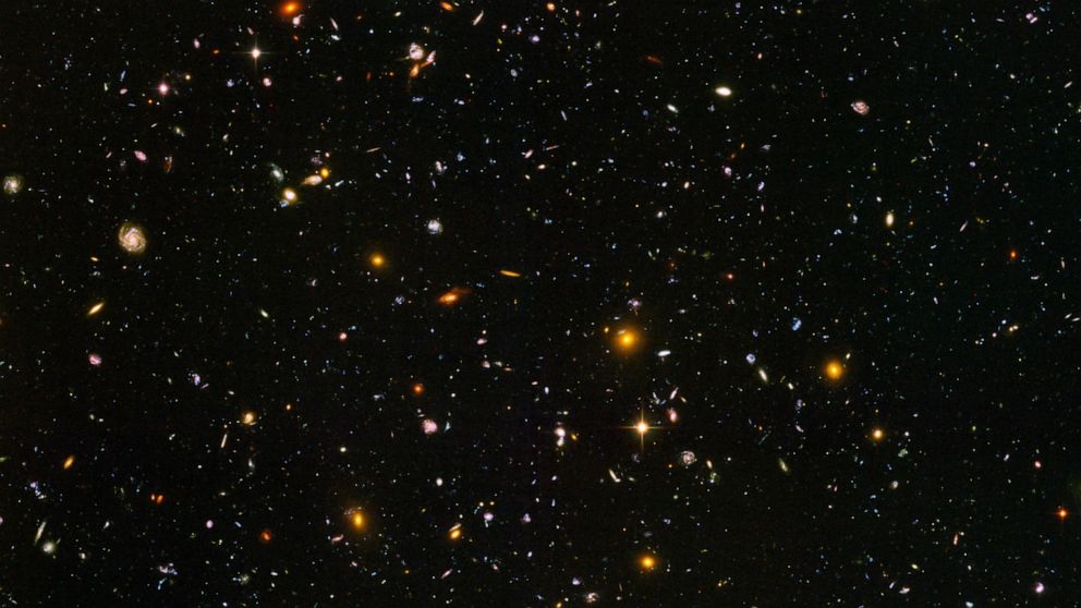 This image made from a composite of September 2003 - January 2004 photos captured by the NASA/ESA Hubble Space Telescope shows nearly 10,000 galaxies in the deepest visible-light image of the cosmos, cutting across billions of light-years. In researc