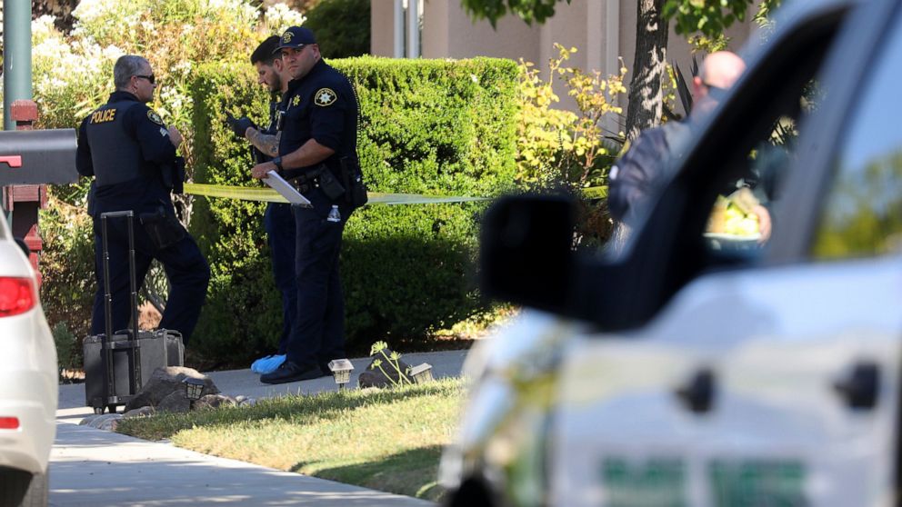 Police officers work the scene of a double homicide at a home on Wednesday, Sept. 7, 2022, in Dublin, Calif. Devin Willams Jr., an Alameda County Deputy Sheriff, is accused in the double-slaying. (Aric Crabb/Bay Area News Group via AP)