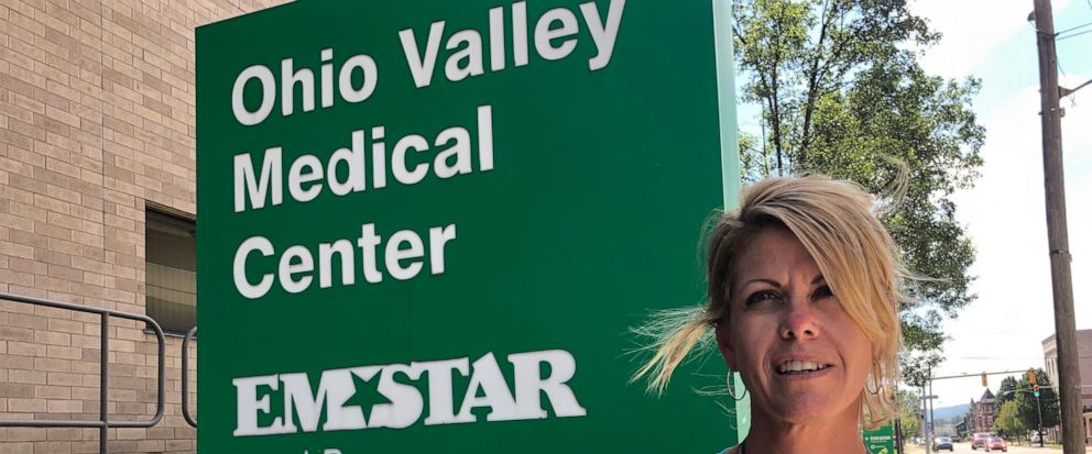Ohio Valley Medical Center employee Carrie Jones is shown Tuesday, Sept. 3, 2019, outside of the hospital in Wheeling, W.Va. The hospital and sister facility East Ohio Regional Hospital in Martins Ferry, Ohio, are closing after two years of ownership