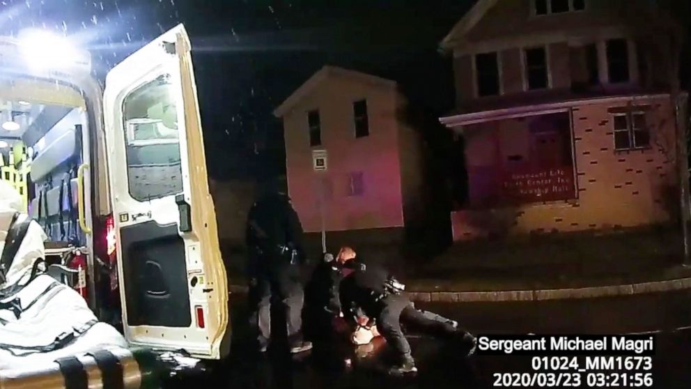 In this image taken from police body camera video provided by Roth and Roth LLP, Rochester police officers hold down Daniel Prude on March 23, 2020, in Rochester, N.Y. Prude, a Black man who had run naked through the streets of the western New York c