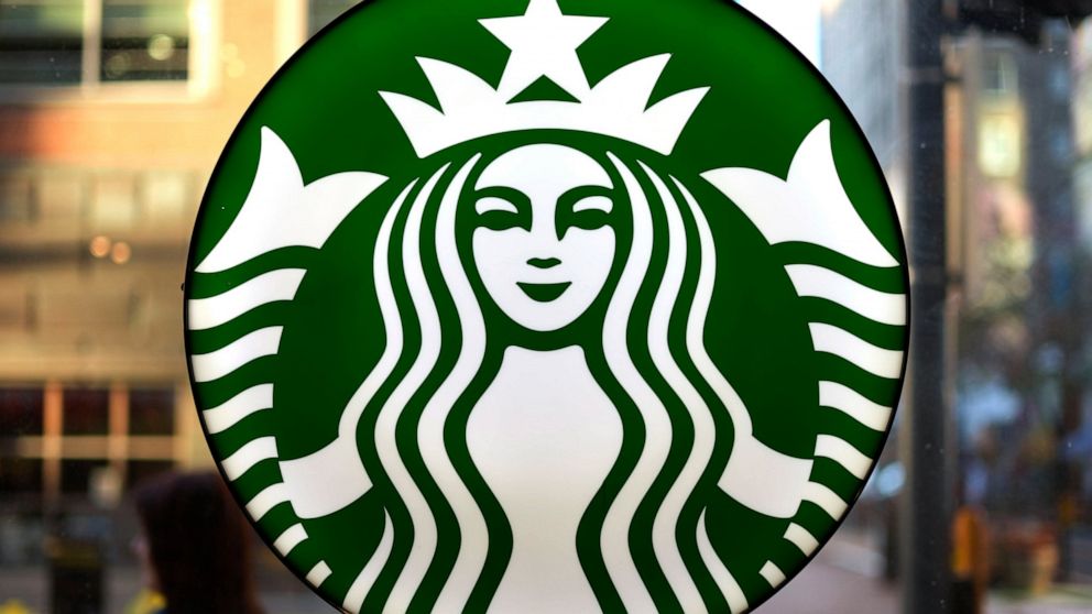 FILE - The Starbucks logo is displayed in the window of a downtown Pittsburgh Starbucks on Monday, Nov. 7, 2022. Workers at more than 100 U.S. Starbucks stores are scheduled to go on strike Thursday, Nov. 17, the same day the company plans its annual