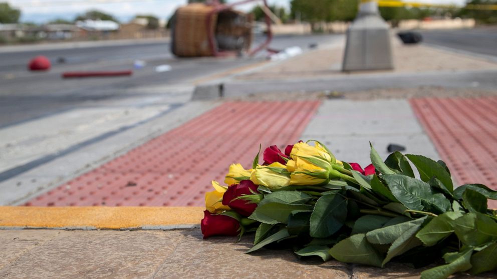 FILE - In this June 26, 2021, file photo, a bouquet of flowers from a mourner is placed near the basket of a hot air balloon which crashed in Albuquerque, N.M. A report from the Federal Aviation Administration shows the pilot of a hot air balloon tha