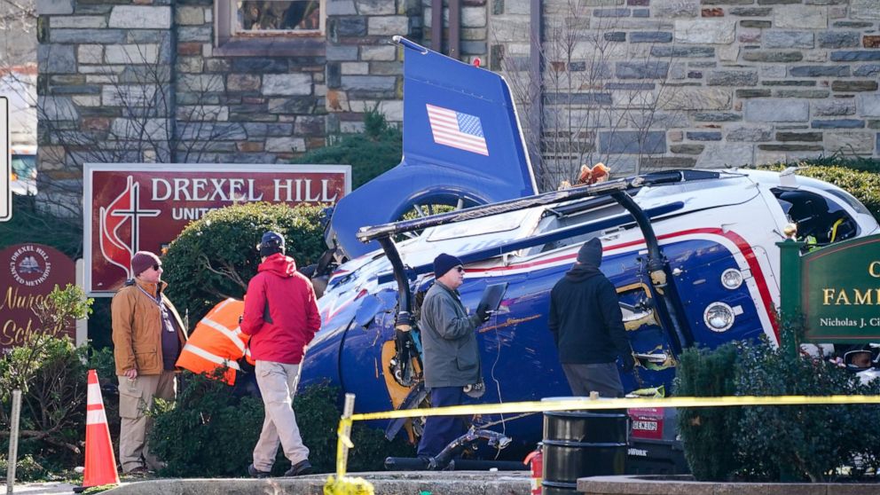  Investigators probe wreckage of crashed medical helicopter