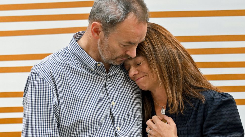 FILE - Simon and Sally Glass comfort each other during an emotional news conference about the death of their son, Christian Glass, Sept. 13, 2022, in Denver. Grand jury indictments allege two Colorado sheriff's deputies needlessly escalated a fatal s