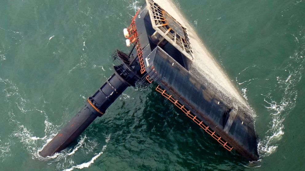FILE- In this April 18, 2021, file photo, the capsized lift boat Seacor Power is seen seven miles off the coast of Louisiana in the Gulf of Mexico. The lift boat had lowered its legs and was trying to turn to face heavy winds when it flipped in the G