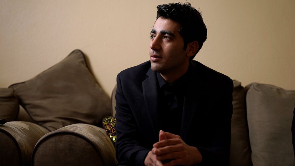 Inamullah Niazai speaks during an interview Tuesday, April 26, 2022, in St. Louis. Niazai is one of about 600 people who have fled Afganistan and made it to St. Louis in the nearly nine months since the Afghan capital of Kabul was ceded to the Taliba