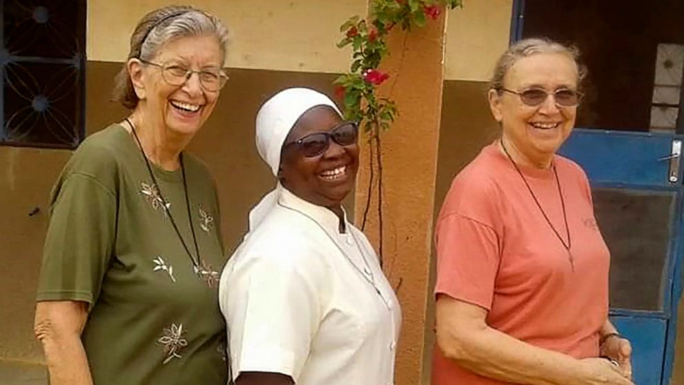 This undated photo courtesy of Marianites of Holy Cross, shows from left, Sister Suellen Tennyson, with Sister Pascaline Tougma, a midwife from Burkina Faso, and Sister Pauline Drouin, a nurse from Lake Magantic in Canada. Sister Suellen Tennyson was