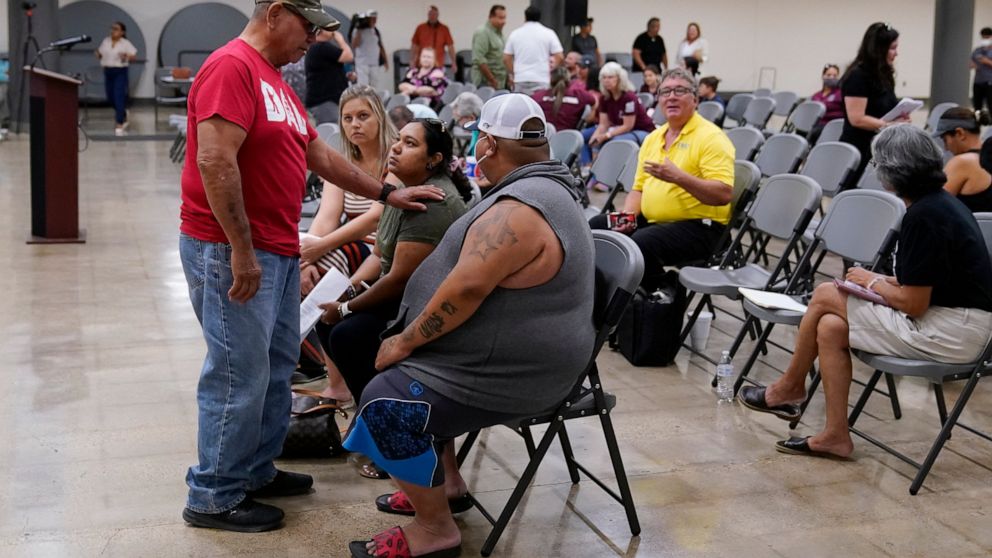 Family members of a shooting victim, who did not wish to share their names, and friends attend a city council meeting, Tuesday, July 12, 2022, in Uvalde, Texas. A Texas lawmaker says surveillance video from the school hallway at Robb Elementary Schoo