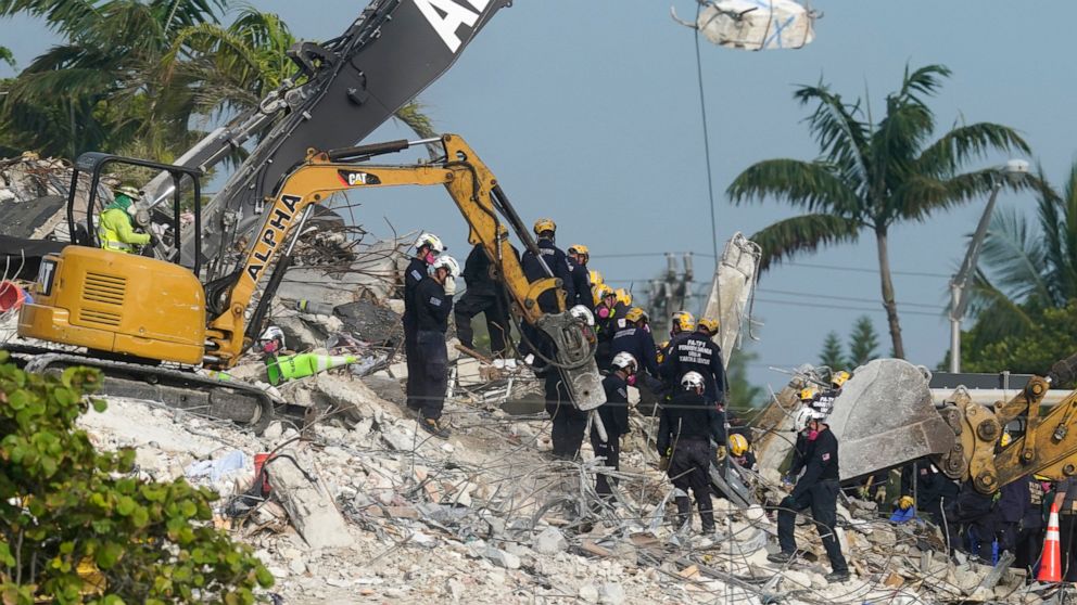 Rescue crews work at the site of the collapsed Champlain Towers South condo building after the remaining structure was demolished Sunday, in Surfside, Fla., Monday, July 5, 2021. Many people are unaccounted for in the rubble of the building which par