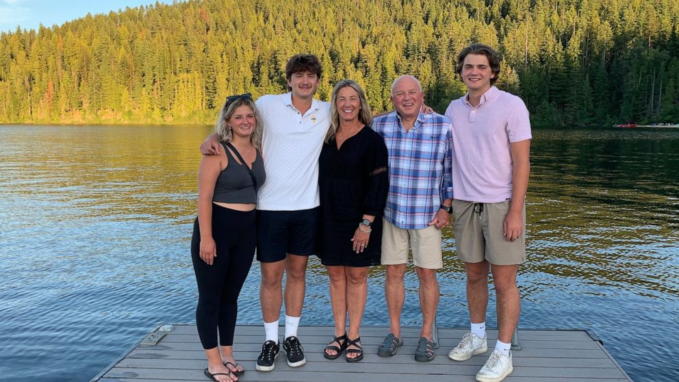 In this photo provided by Stacy Chapin, triplets Maizie, left, Ethan, second from left, and Hunter, right, pose with their parents Stacy and Jim Chapin at Priest Lake in northern Idaho in July 2022. Ethan Chapin was one of four University of Idaho st