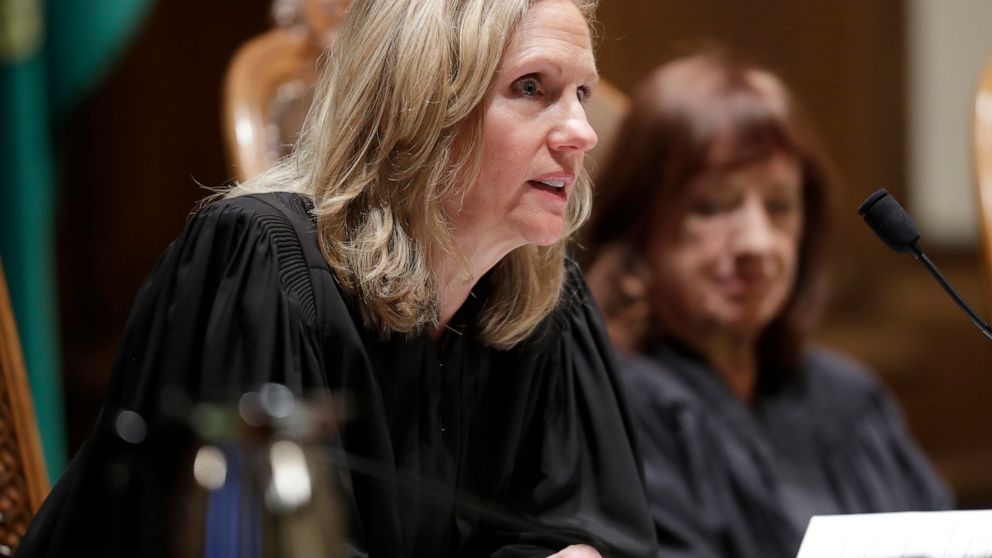 FILE - Washington Supreme Court Justice Debra Stephens is shown during a swearing-in ceremony in Olympia, Wash., on Jan. 6, 2020. One year after saying virtual life sentences are unconstitutional for teenage killers, the court changed course Thursday