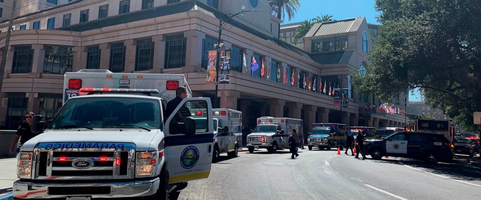 Fire crews gather on Market Street outside the Hotel Fairmont in downtown San Jose, Calif., after a report of a chemical odor Saturday, Aug. 31, 2019. Authorities say at least one woman has died and several people have been sickened in a hazmat incid