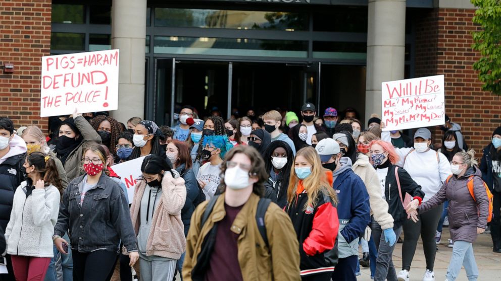 Students leave the Ohio Union on the campus of Ohio State University to protest the shooting of Ma'Khia Bryant a day earlier by Columbus Police, Wednesday, April 21, 2021, in Columbus, Ohio. (AP Photo/Jay LaPrete)