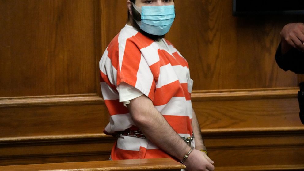 FILE - Ahmad Al Aliwi Alissa, accused of killing 10 people at a Colorado supermarket in March, is led into a courtroom for a hearing Tuesday, Sept. 7, 2021, in Boulder, Colo. Experts have found Alissa is mentally incompetent to proceed in the case, a
