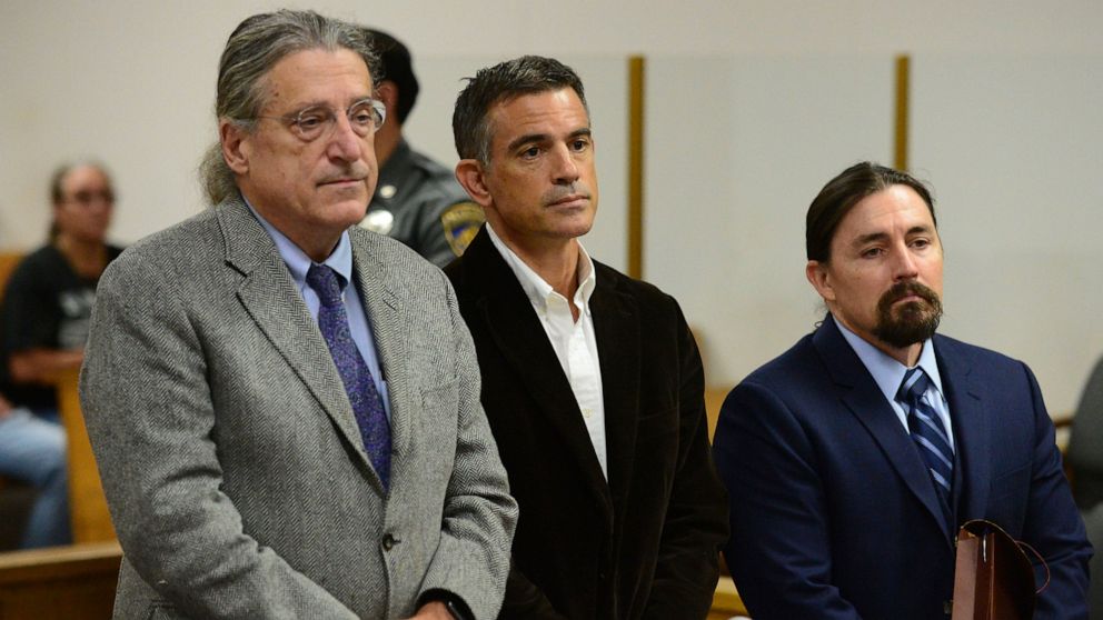 FILE - In this Sept. 12, 2019, file photo, Fotis Dulos, center, appears with his attorney Norm Pattis, left, during Dulos' arraignment on a new tampering with evidence charge at state Superior Court in Norwalk, Conn. The lawyers for Fotis Dulos, the 