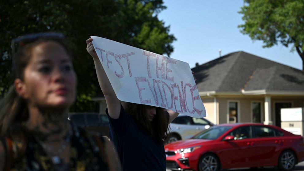 Supporters of Damien Echols holds signs outside the West Memphis District Courthouse as they wait for the conclusion of a hearing that would release evidence from the 1993 killings for testing for new DNA evidence on Thursday, June 23, 2022, in West 