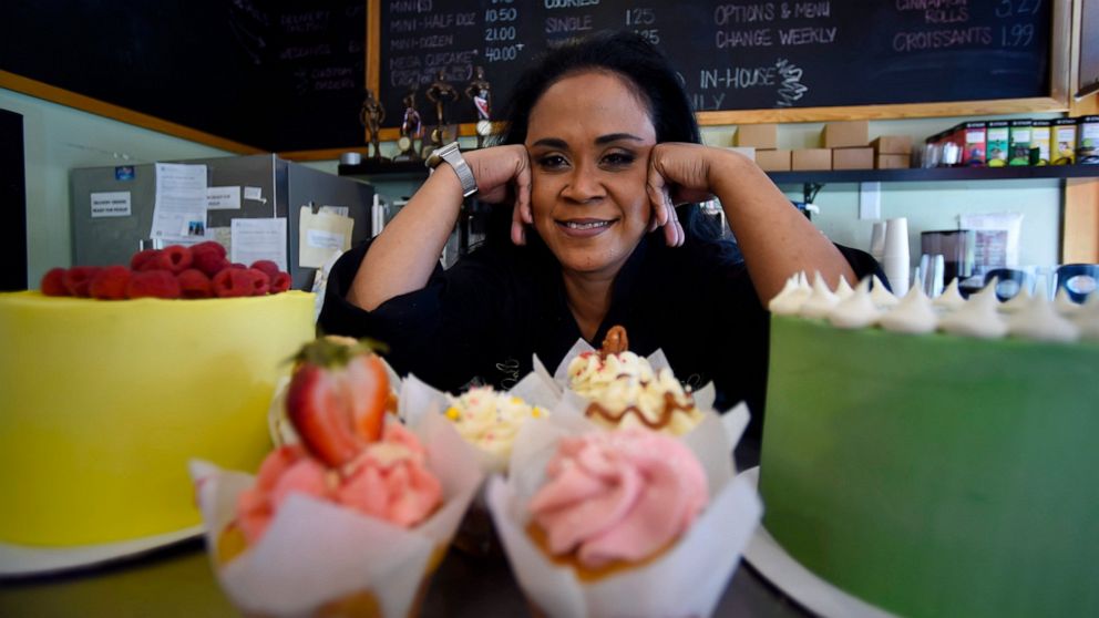 Shirley Hughes, owner of Sweet Cheats bakery, poses for a photo, Friday, April 15, 2022, in Atlanta. Some small businesses are still struggling to hire qualified workers, even as the broader picture in the U.S. job market looks much brighter. (AP Pho