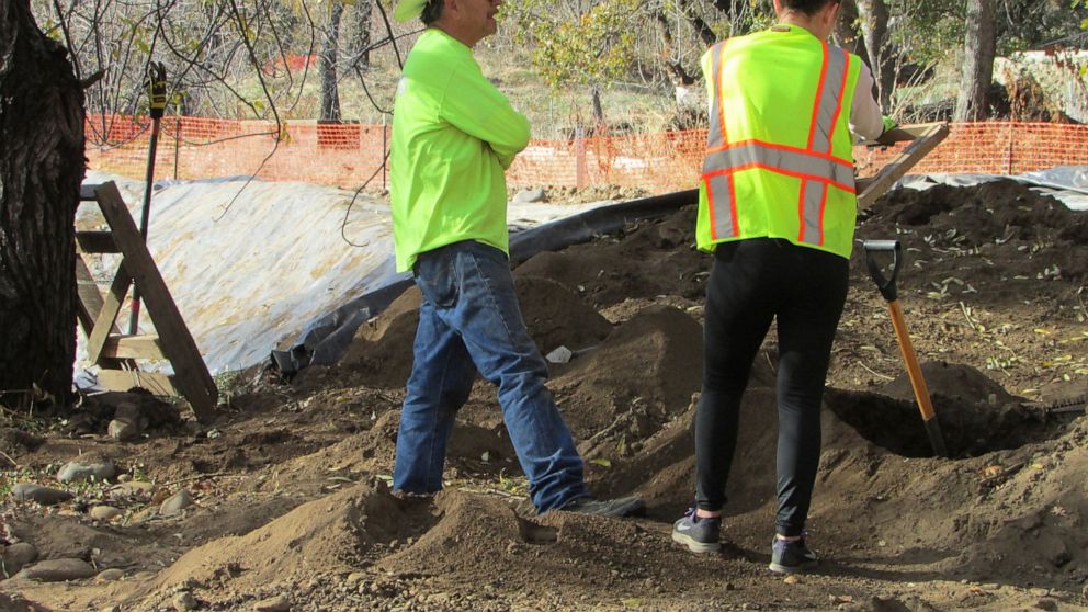 In this photo provided by Shawna Garcia, monitors working with the Wintu Tribe of Northern California search for remains and artifacts at a construction site on Nov. 30, 2022, where a trail and parking area along the Sacramento River will soon open i