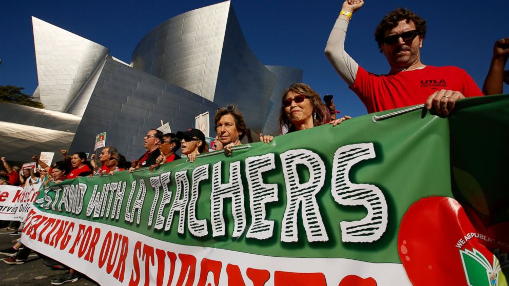 In this Saturday, Dec. 15, 2018 photo, thousands of teachers rally against the nation's second-largest school district in downtown Los Angeles. A massive teachers strike in Los Angeles is all but inevitable starting Monday, Jan. 14, 2019, after the t