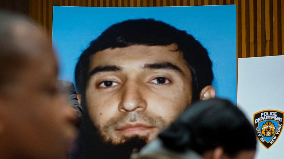 FILE - A photo of Sayfullo Saipov is displayed at a news conference at One Police Plaza in New York, Nov. 1, 2017. About 200 potential jurors for the trial of Saipov, charged with killing eight people on a New York City bike path in a terror attack, 