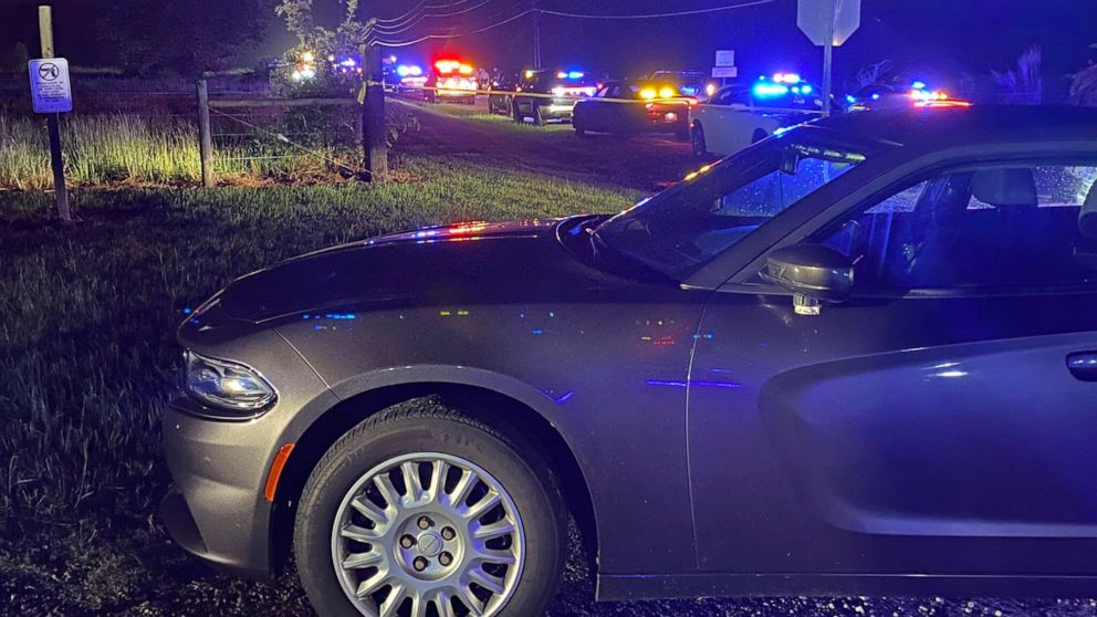 In this photo provided by Wake County Sheriff's Office on Twitter, is the scene of a deputy-involved incident on Battle Bridge Road, near Auburn-Knightdale Road, Thursday, Aug. 11, 2022, in Wake County, N.C. Authorities in North Carolina are trying t