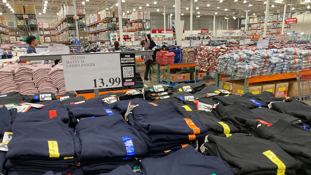 FILE - Clothing sits on tables for shoppers in a Costco warehouse Monday, Aug. 29, 2022, in Sheridan, Colo. The Federal Reserve is expected to raise its key short-term rate by a substantial three-quarters of a point for the third consecutive time Wed