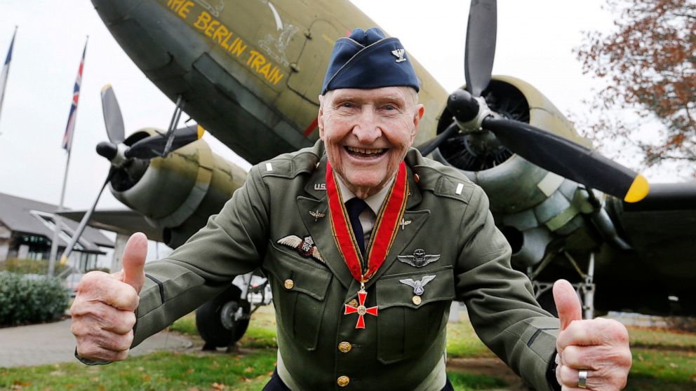 FILE - "Candy Bomber" pilot Gail Halvorsen gives thumbs up in front of an old US military aircraft with the name "The Berlin Train" in Frankfurt, Germany, on Nov. 21, 2016. The man known as the "Candy Bomber" for his airdrops of sweets during the Ber