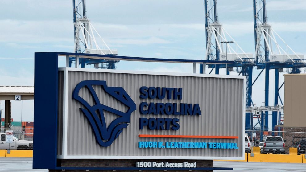 FILE - A sign marks the site of a new South Carolina Ports Authority terminal named for longtime state Sen. Hugh Leatherman on Monday, Oct. 25, 2021, in North Charleston, S.C. Work has finished on deepening the ship channel leading to the port to 52 