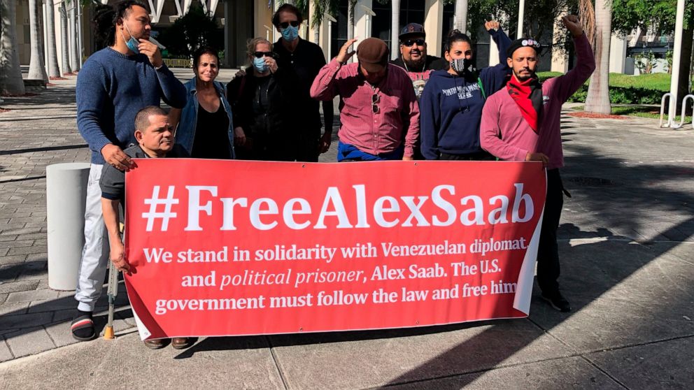 Venezuelan government supporters stand outside outside the federal courthouse in Miami, Fla., Monday, Nov. 15, 2021, the day of the arraignment of Venezuelan businessman Alex Saab. Saab, who is accused of siphoning off millions in state contracts fro