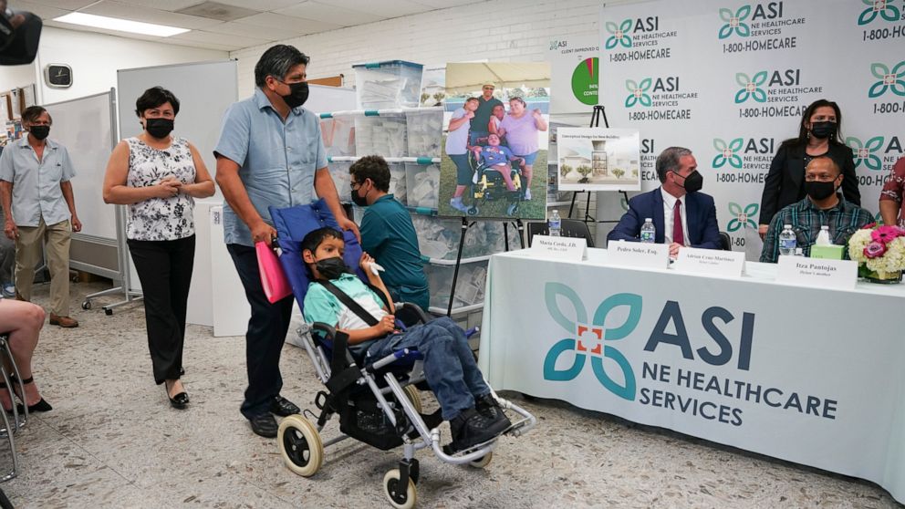 In this photo provided by Clifford Law Offices, Karina Aguilar, her husband, Temo Aguilar, and their son Felipe Aguilar attend a news conference on Aug. 3, 2021, at the office of ASI/NE Healthcare Services in Chicago. After Itza Pantoja's severely di