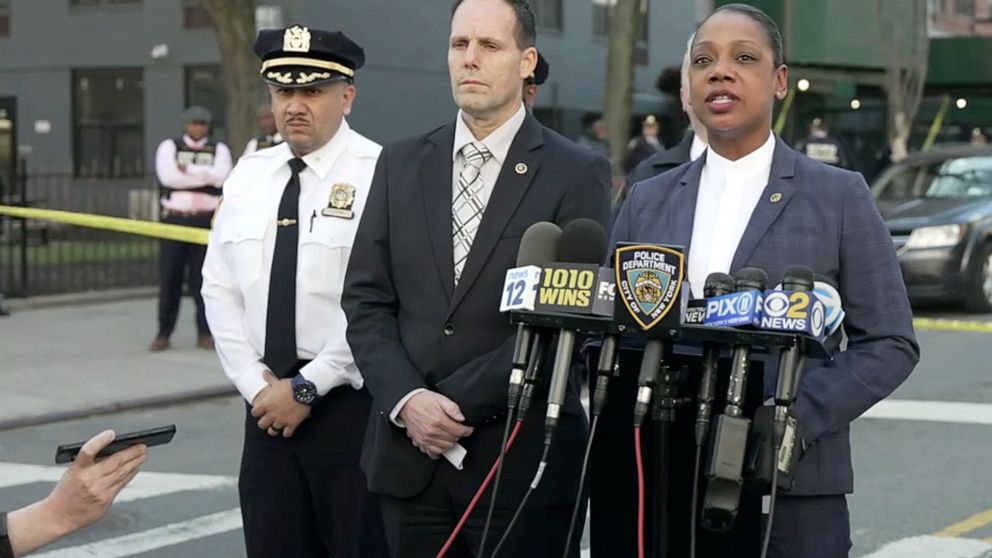 In this image taken from video provided by the NYPD, New York Police Commissioner Keechant Sewel, right, speaks during a news conference, Friday, April 8, 2022, in New York. A teenage girl has been killed and two other teens wounded in a shooting nea
