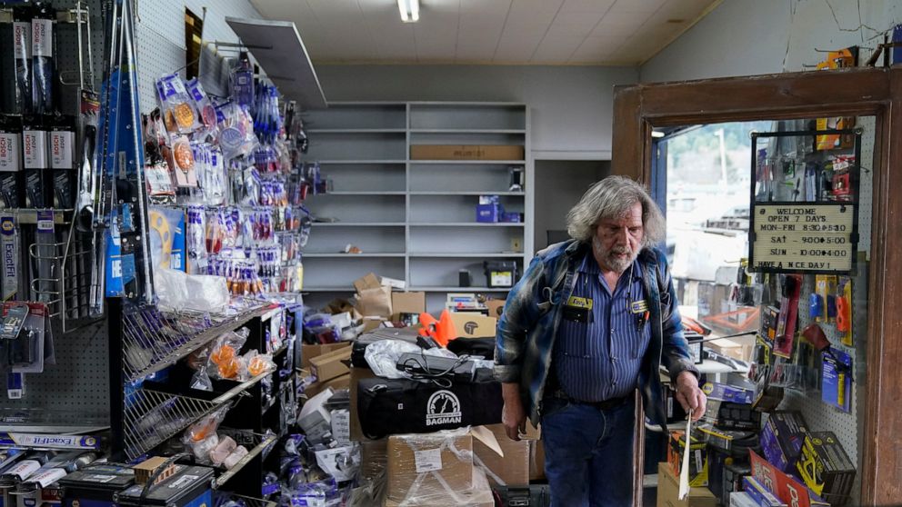 Kenny Ransbottom walks through debris inside his auto parts store after an earthquake in Rio Dell, Calif., Tuesday, Dec. 20, 2022. A strong earthquake shook a rural stretch of Northern California early Tuesday, jolting residents awake, cutting off po