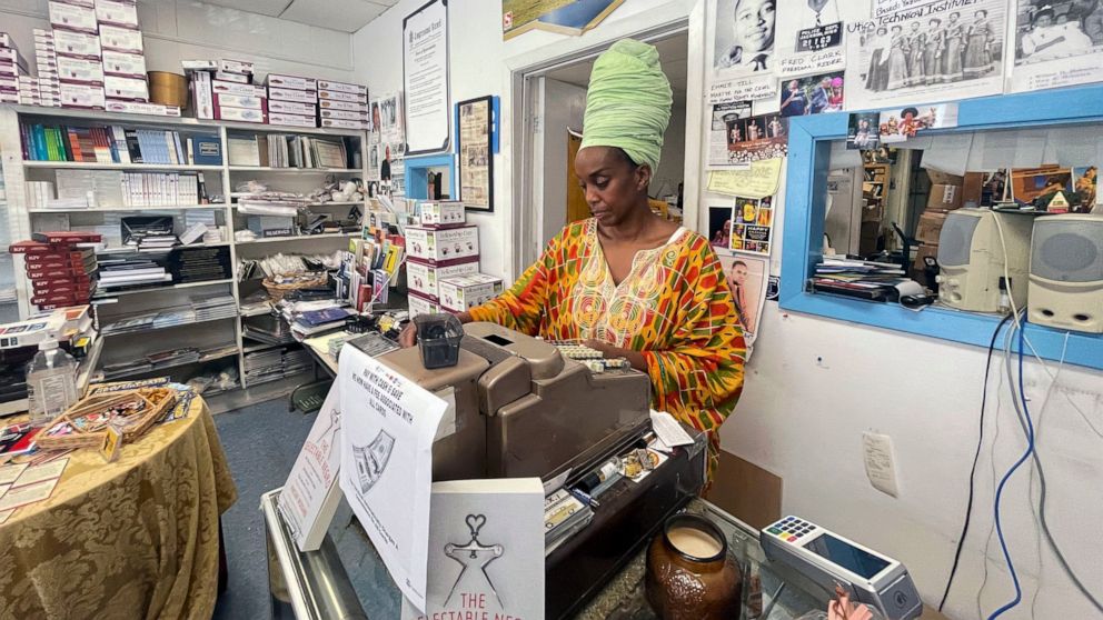 Maati Jone Primm looks down at her notes in her store Marshall's Music and Bookstore in Farish Street Historic District, Thursday, Sept. 1, 2022 in Jackson, Miss. She said white flight is at the root of Jackson's water woes. (AP Photo/Michael Goldberg)
