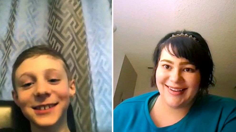 In this April 15, 2020, photo, Sara Herlevsen, right, tutors nine-year-old Corban Music on topics from Vikings to ghosts over a Zoom video conference call in Calgary, Alberta. Herlevsen offers free online lessons to help parents and their children du