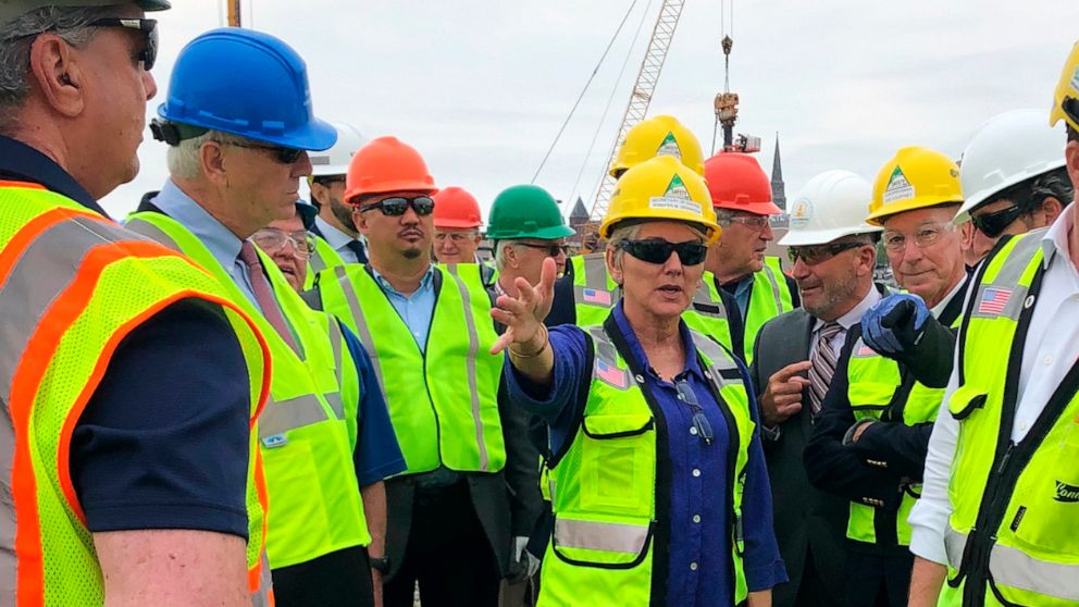 U.S. Energy Secretary Jennifer Granholm, center, tours the New London State Pier facility Friday, May 20, 2022 to view progress on a hub for the offshore wind power industry in New London, Conn. The U.S. energy secretary and Danish wind developer Ors