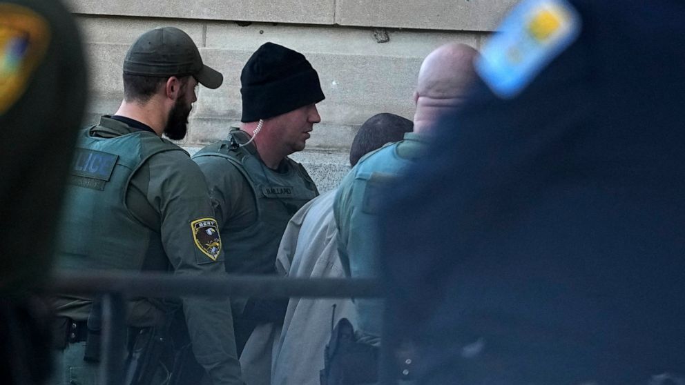 Officers escort Richard Matthew Allen into the Carroll County Courthouse, Tuesday, Nov. 22, 2022, in Delphi, Ind. An Indiana judge will hear if sealed court documents with evidence that led to a Allen's arrest in the 2017 slayings of two teenage girl