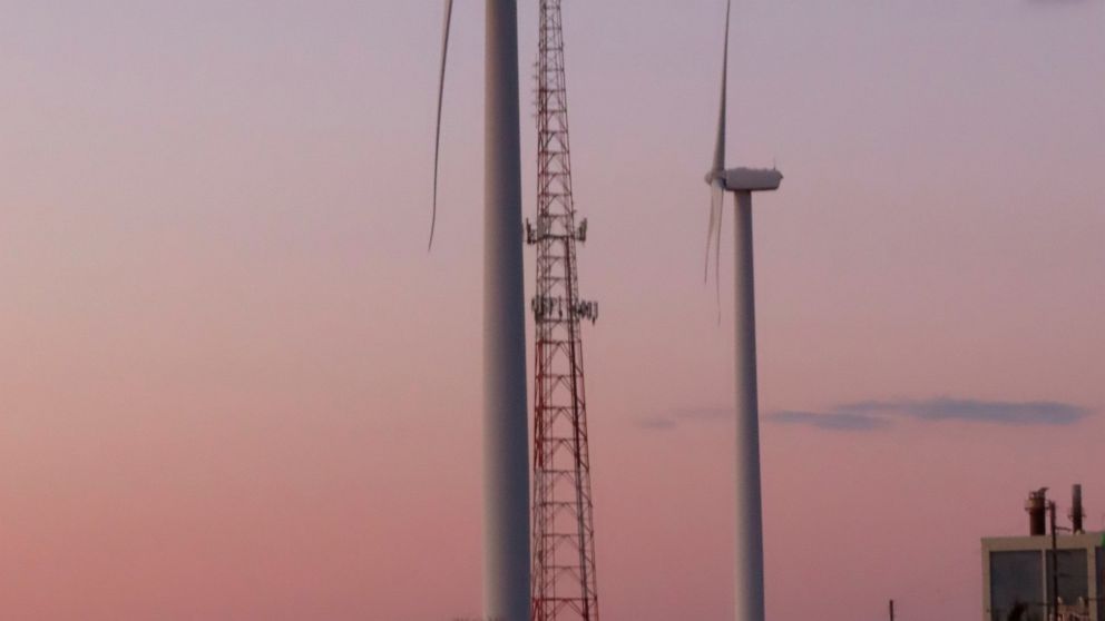 This Feb. 10, 2022, photo shows land-based wind energy turbines in Atlantic City, N.J. Offshore wind energy projects in many places in the U.S. are facing local opposition from those who fear possible environmental, economic and aesthetic impacts fro