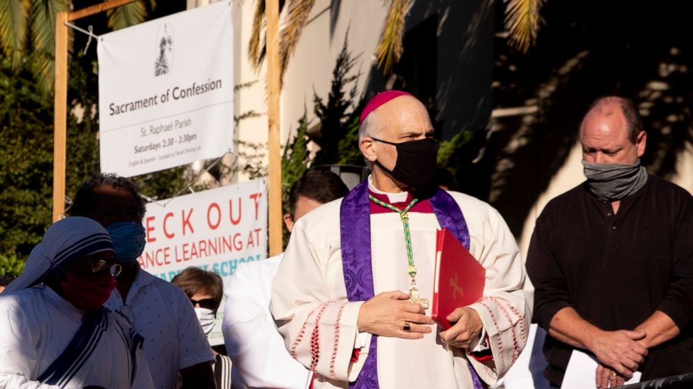 San Francisco's Archbishop Salvatore Cordileone conducts an exorcism Saturday, Oct. 17, 2020, outside of Saint Raphael Catholic Church in San Rafael, Calif., on the spot where a statue of St. Junipero Serra was toppled during a protest on Oct. 12. (J