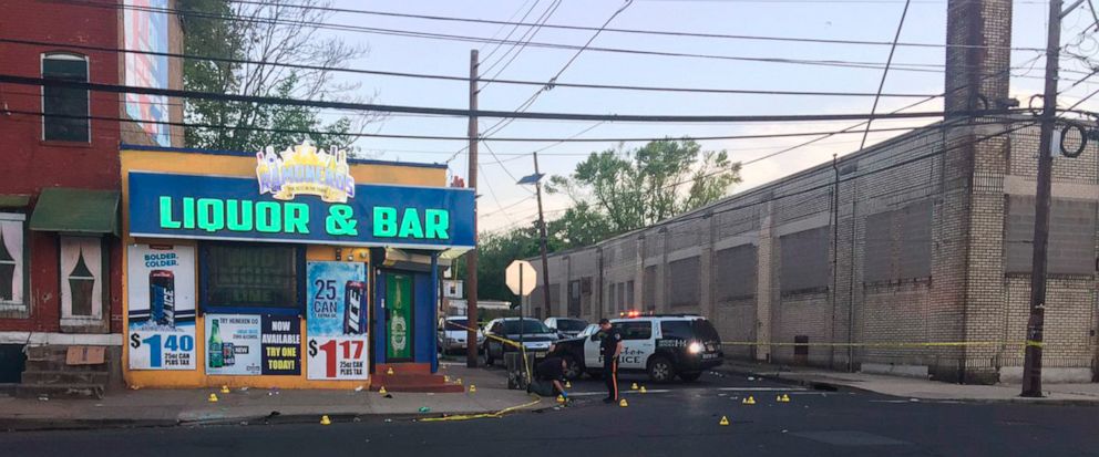 This photo provided by 3 CBS Philadelphia shows police canvasing the scene of a shooting in Trenton, N.J. on Saturday, May 25, 2019. New Jersey police say 10 people have been wounded following a shooting at a Trenton bar. Trenton police spokesman Cap