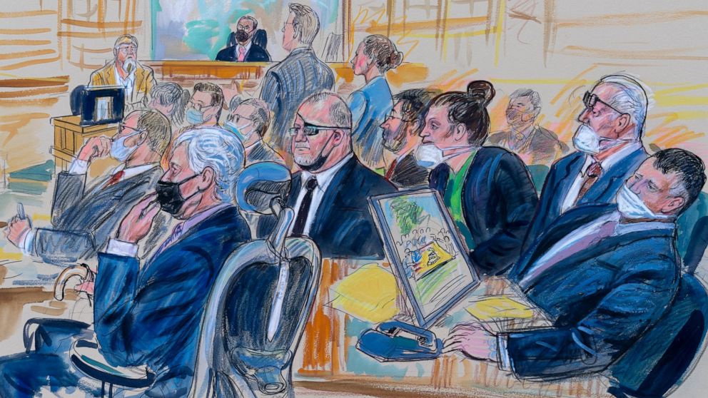 This artist sketch depicts the trial of Oath Keepers leader Stewart Rhodes and four others charged with seditious conspiracy in the Jan. 6, 2021, Capitol attack, in Washington, Thursday, Oct. 6, 2022. Shown above are, witness John Zimmerman, who was 