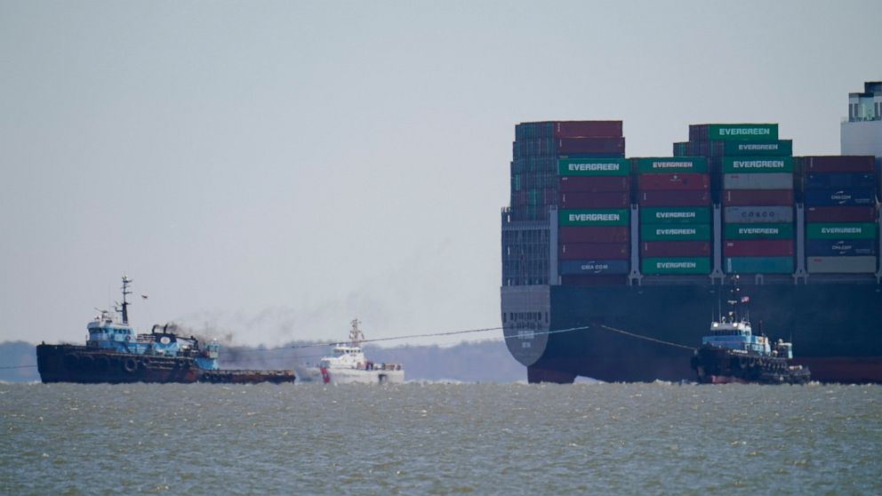 The tugboats Atlantic Enterprise, left, and Atlantic Salvor, bottom right, use lines to pull the container ship Ever Forward, top right, which ran aground in the Chesapeake Bay, as crews began to attempt to refloat the ship, Tuesday, March 29, 2022, 