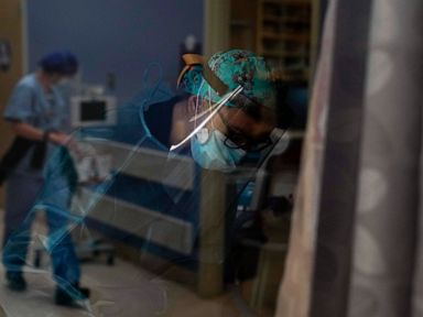 California reports record 695 virus deaths in a day