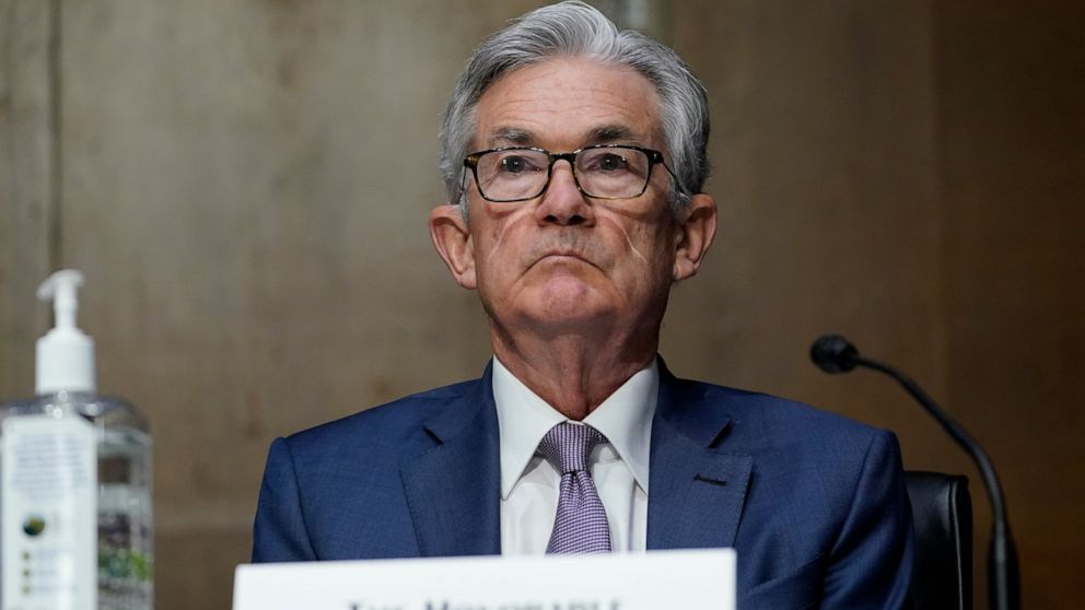 FILE - In this Dec. 1, 2020 file photo, Chairman of the Federal Reserve Jerome Powell appears before the Senate Banking Committee on Capitol Hill in Washington. Powell says the economic outlook has “clearly brightened” in the United States but the re